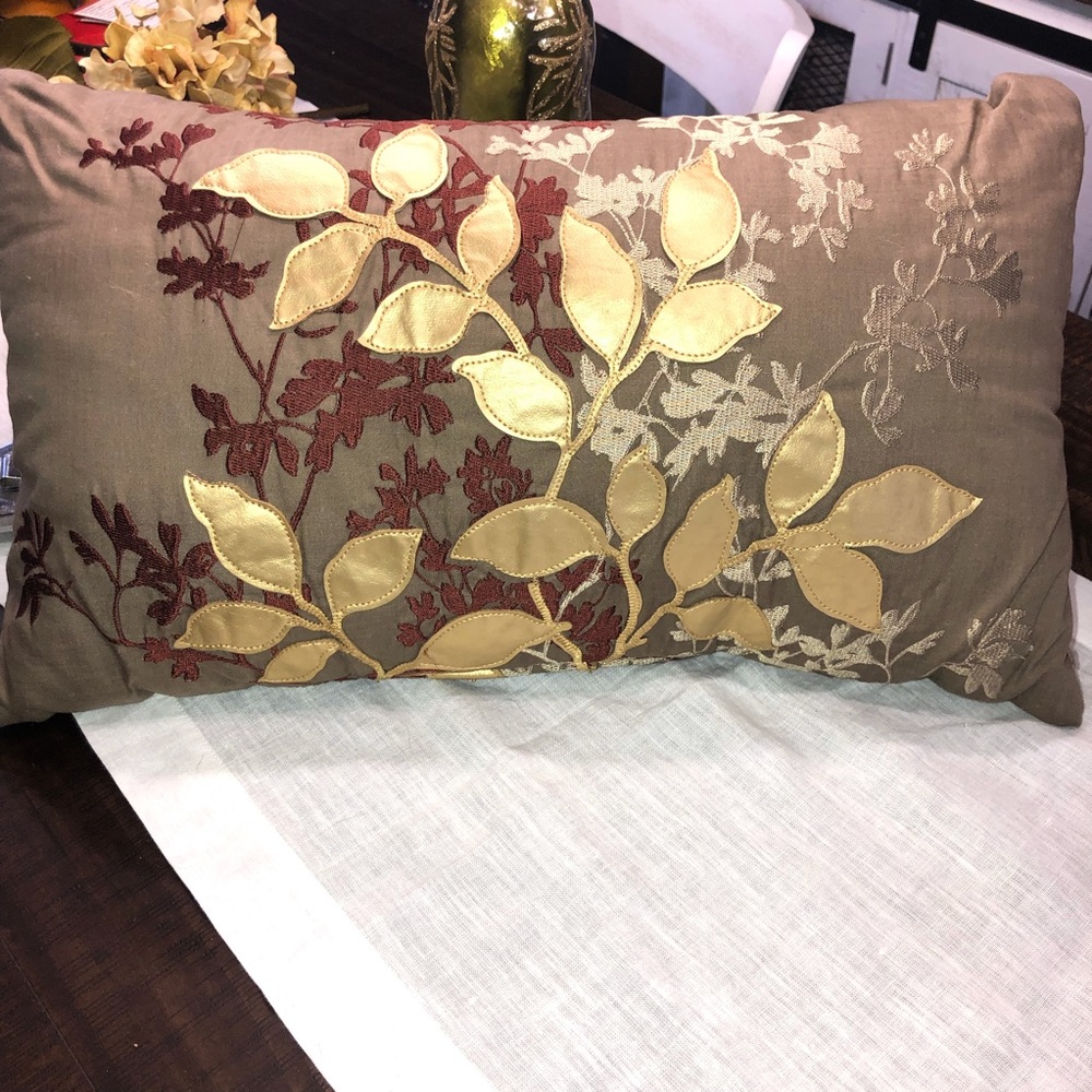 Decorative pillow. Embroidered and stitched beautifully with golden leaves.